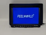 Feelworld FW759 7" On-camera Field Monitor 4K Hdmi Ips W/sun Shade. No Bat/mount Used. Price: $60.00.